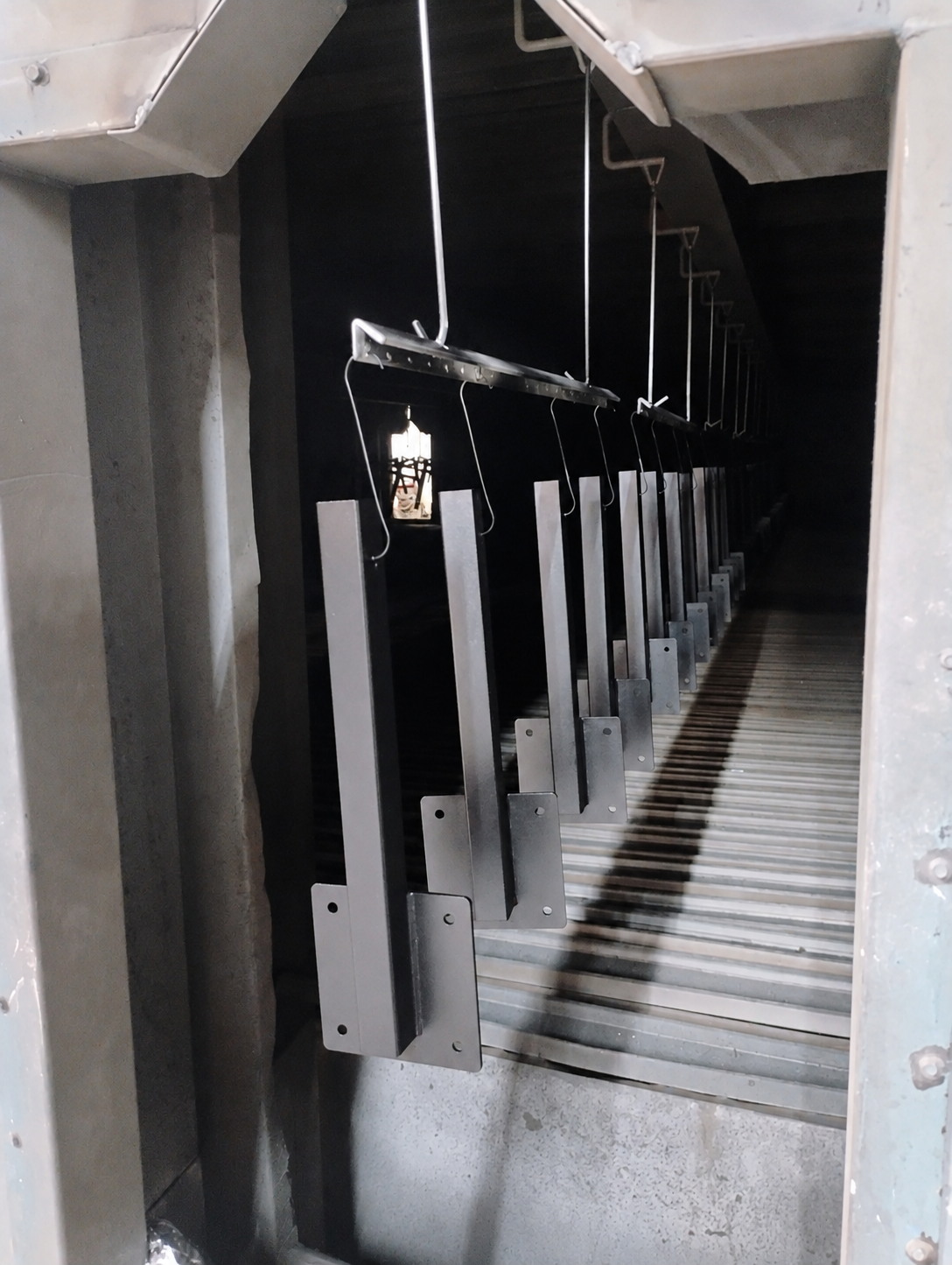 GenCaddy carrier arms moving through the powder-coating line