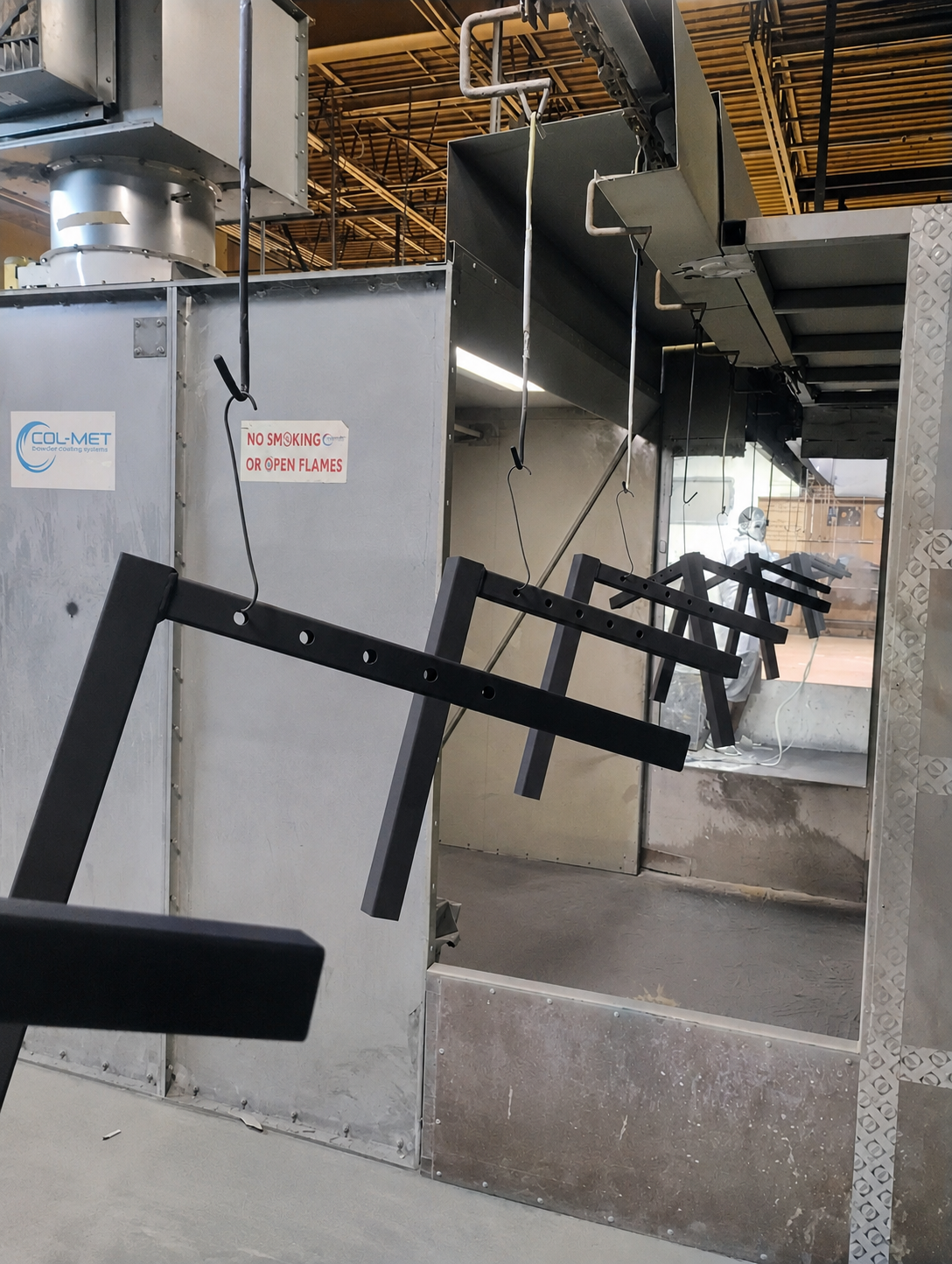 Finished GenCaddy adjustable arms leaving the powder-coating area